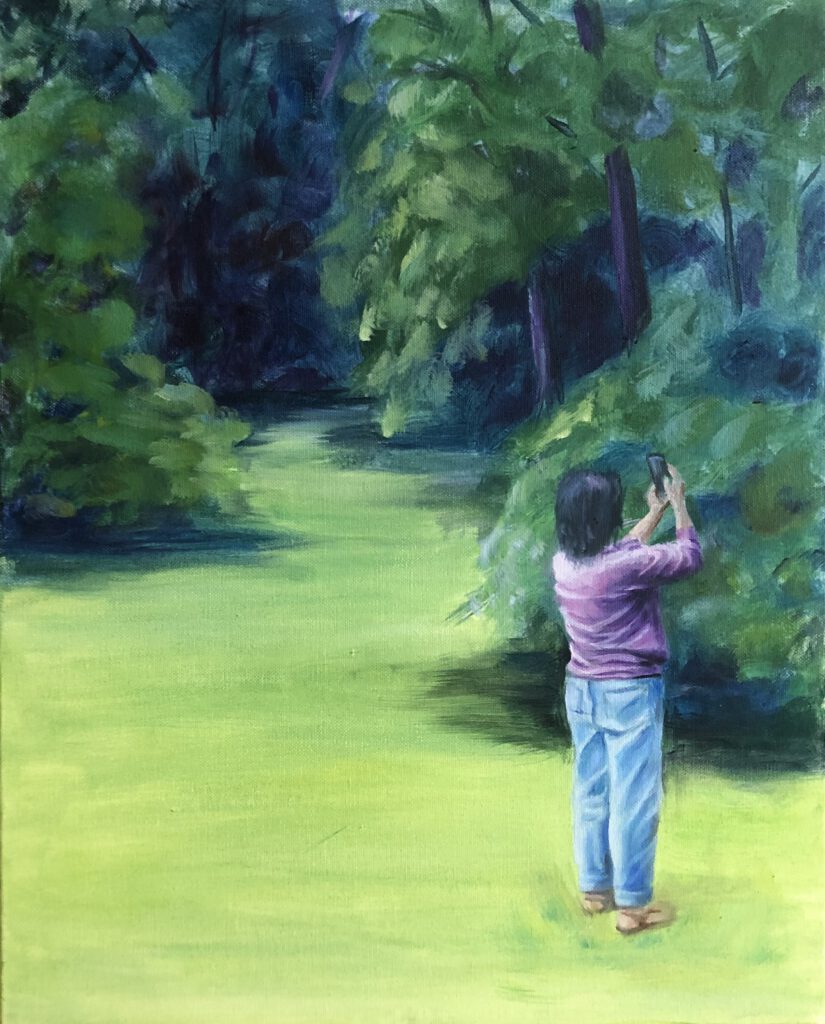 Oil painting of a barefoot woman standing on a green clearing at the edge of a dense, shadowy forest. She is holding up a phone as if taking a photo or video of the trees. The scene contrasts the vivid greens of nature with quiet human presence and gesture.